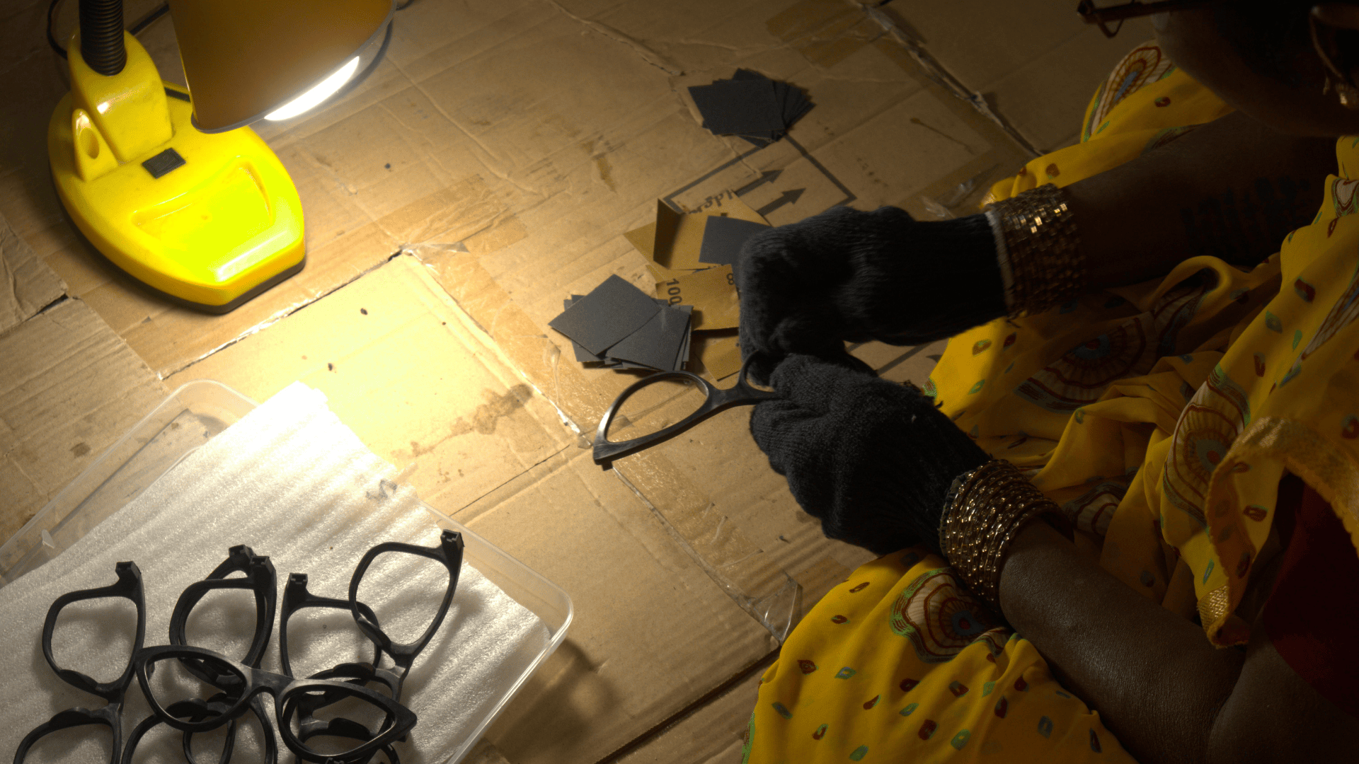 A woman handcrafts recycled sunglasses from MLP plastic in a workshop by Without, a Scale-Up startup at Marico Innovation Foundation