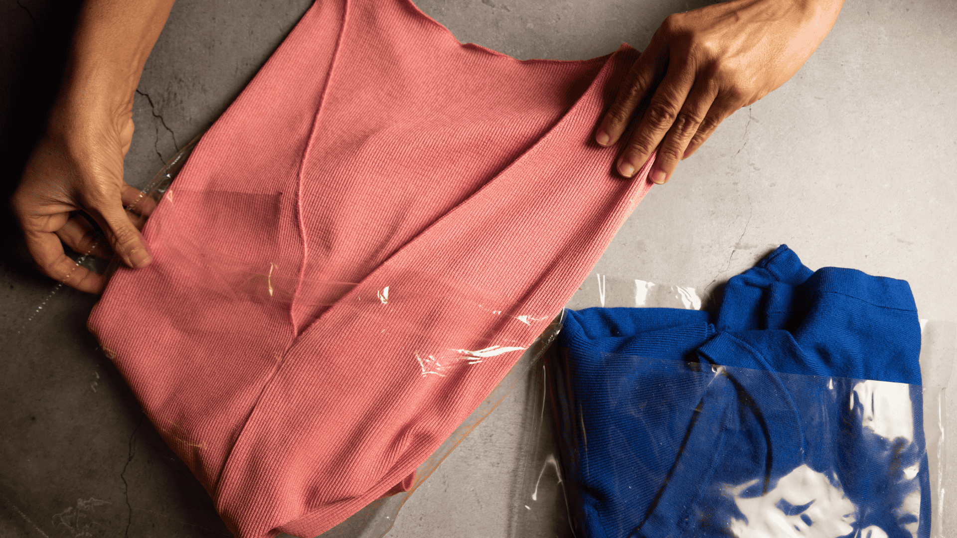 A pink and blue garment being packed in seaweed-based, home-compostable packaging by Zerocircle, a Scale-Up portfolio startup supported by the Marico Innovation Foundation.