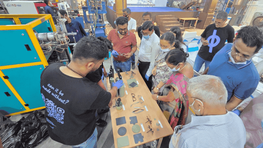 A group of mentors and team members observe recycled material samples during a visit to the Without by Ashaya facility, part of Marico Innovation Foundation’s Scale-Up mentorship program supporting sustainable startups.