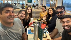 MIF colleagues smiling around a table during an offsite meal