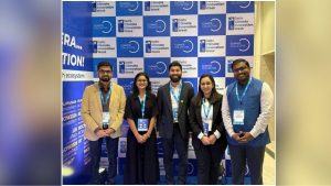 MIF team members standing in front of a Delhi Climate Innovation Week backdrop with Climate Collective branding.