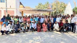 Farmers, community members, and MIF team gathered in a village setting during the post-harvest agri-pilot visit.