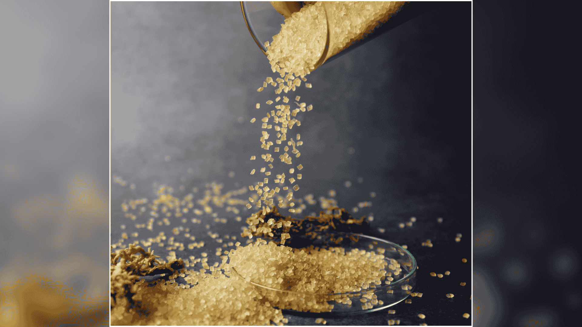Golden granules being poured into a glass dish next to dried seaweed.