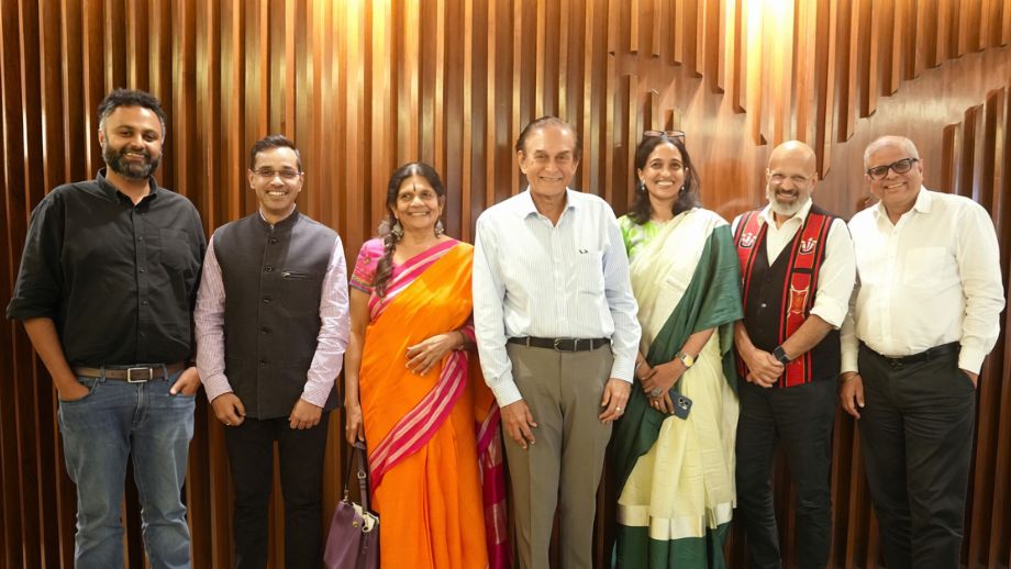 Six members of the Marico Innovation Foundation social jury standing together and smiling for a group photograph in front of a slatted wooden wall.